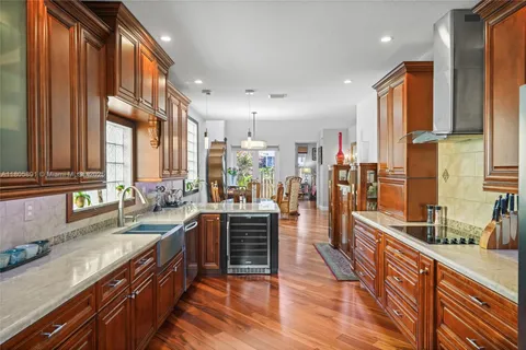 a view of a building with a yard and palm trees