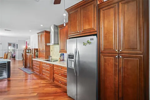an aerial view of multiple houses with yard