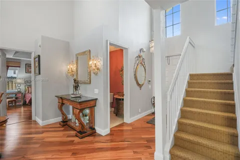 an aerial view of residential houses with city view