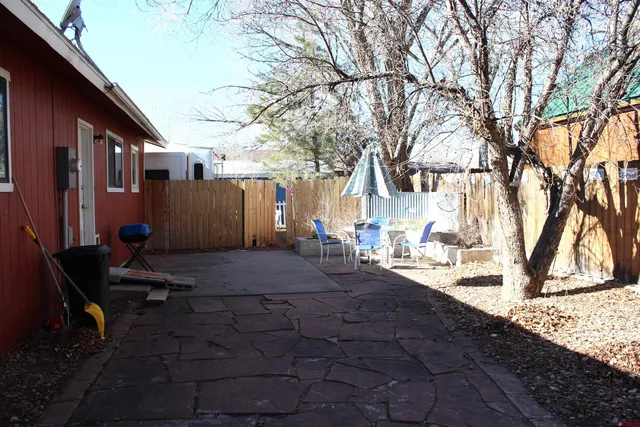a outdoor space with a table and chairs