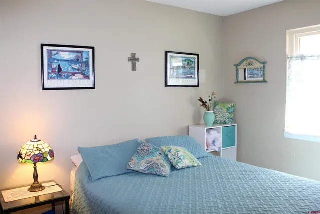 a living room with furniture and flowers