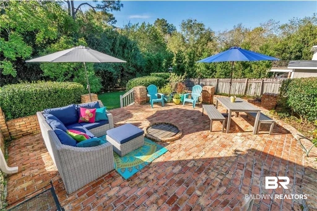 451 Ridgelawn Drive West Mobile, AL 36608 - Photo 6 of 41 View of patio / terrace featuring an outdoor hangout area, fence, and view of wooded area