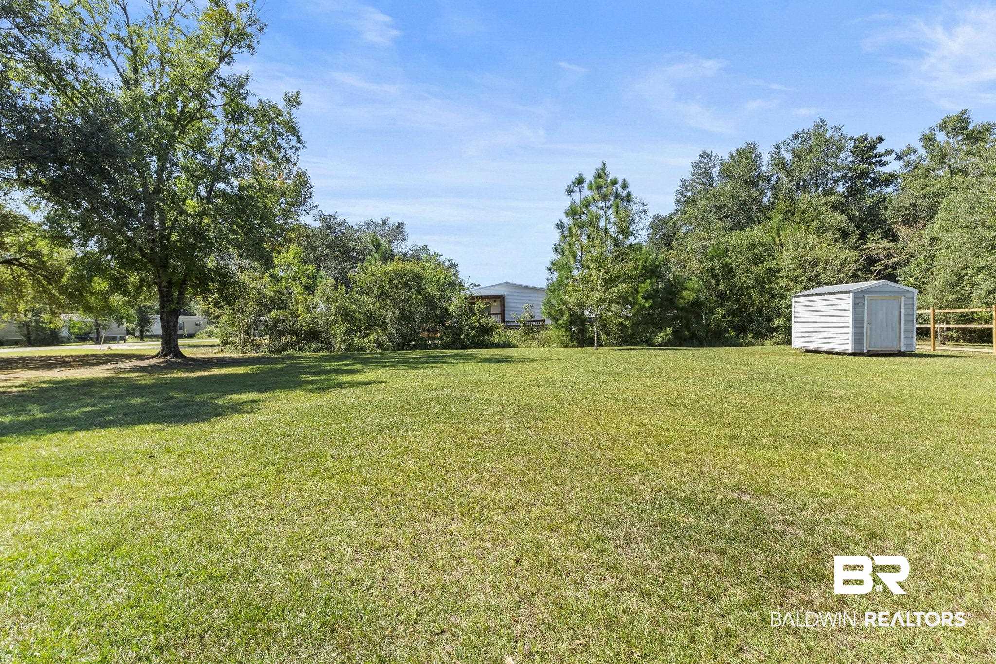 6870 Cecilia Court Theodore, AL 36582 - Photo 59 of 83 View of yard with a storage unit