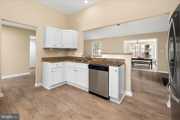 a bedroom with a large bed and a large window