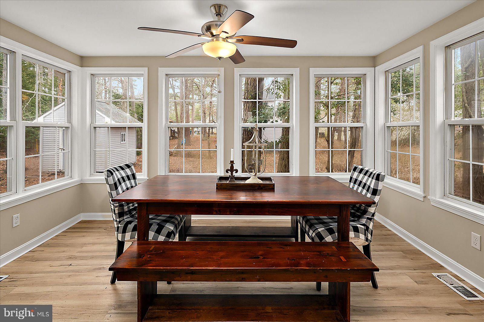 37 Watertown Road Ocean Pines, MD 21811 - Photo 17 of 86 a dining room with furniture a chandelier and wooden floor