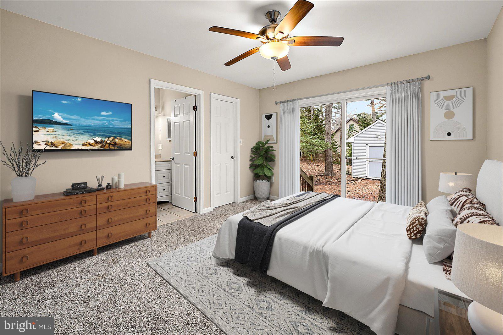 37 Watertown Road Ocean Pines, MD 21811 - Photo 24 of 86 a spacious bedroom with a bed and a flat screen tv