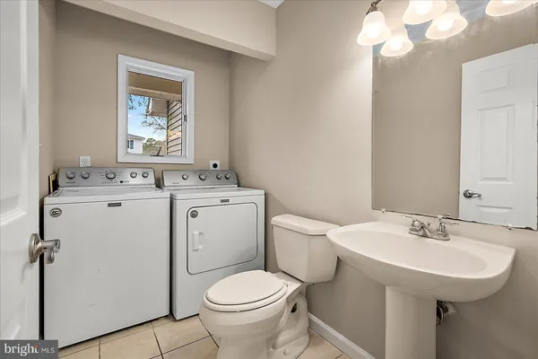 a view of a house with backyard patio and swimming pool