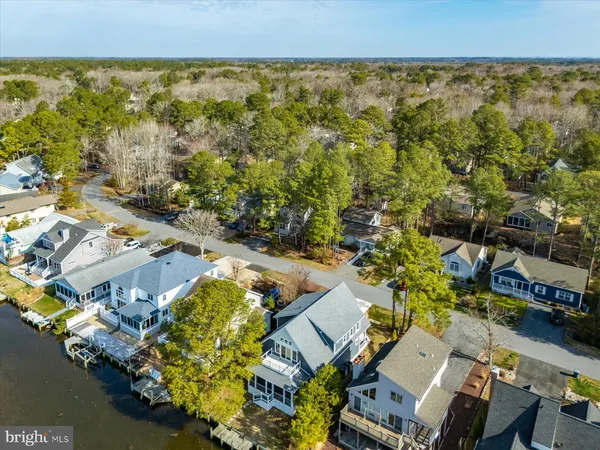 an aerial view of a house with a yard basket ball court