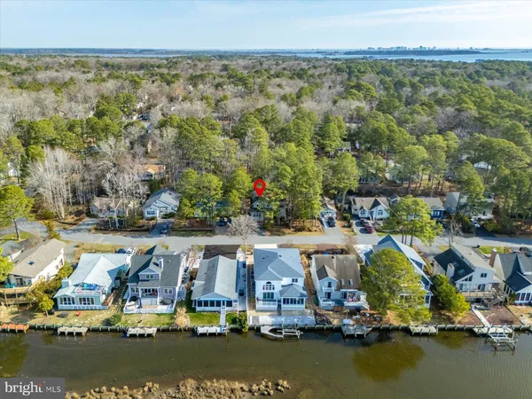 an aerial view of a pool yard patio and lake view