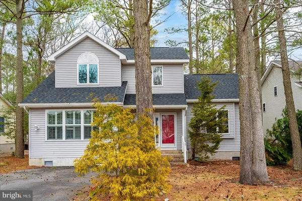 a view of empty room with a fireplace and fan