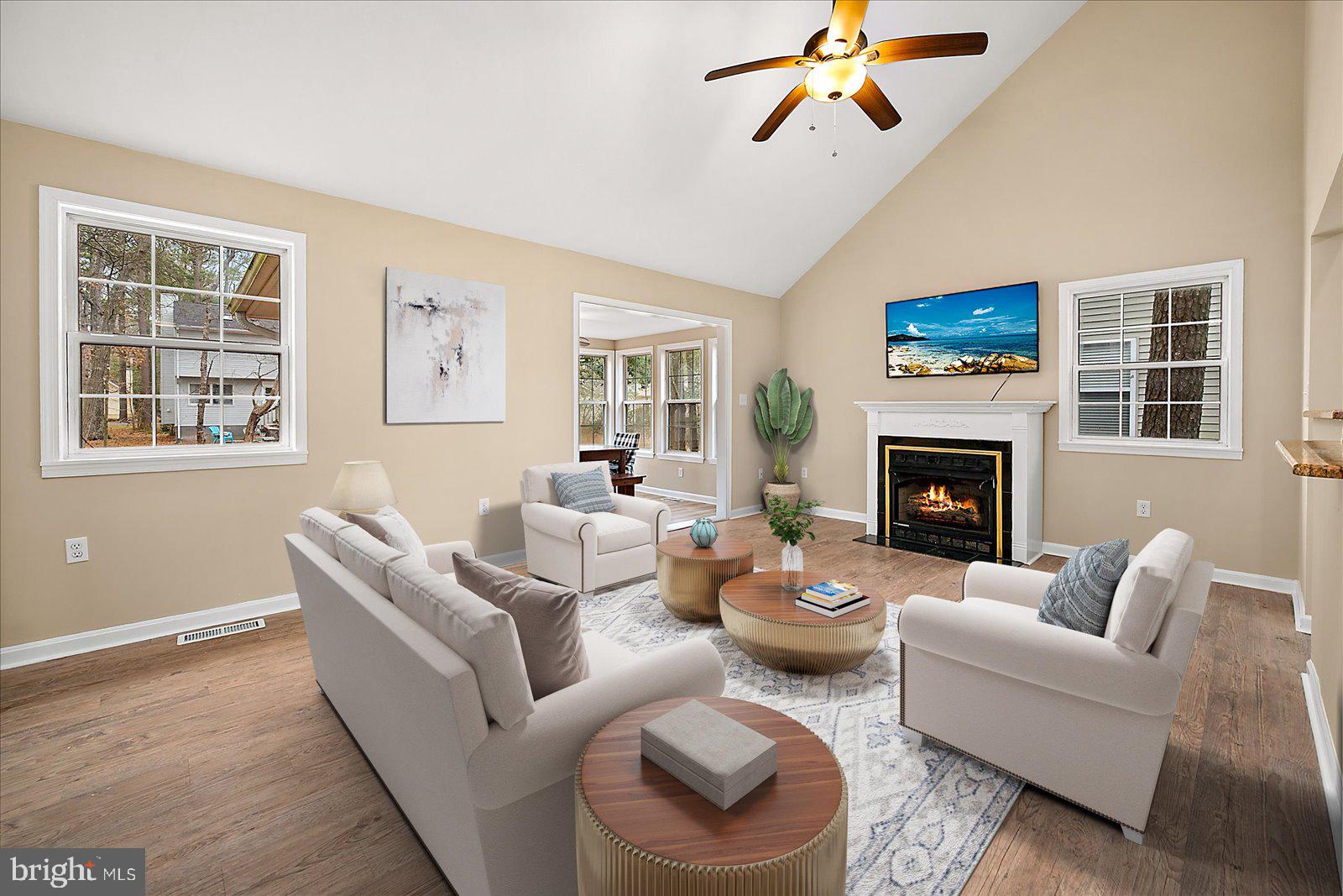 37 Watertown Road Ocean Pines, MD 21811 - Photo 8 of 86 a living room with furniture a fireplace and a window