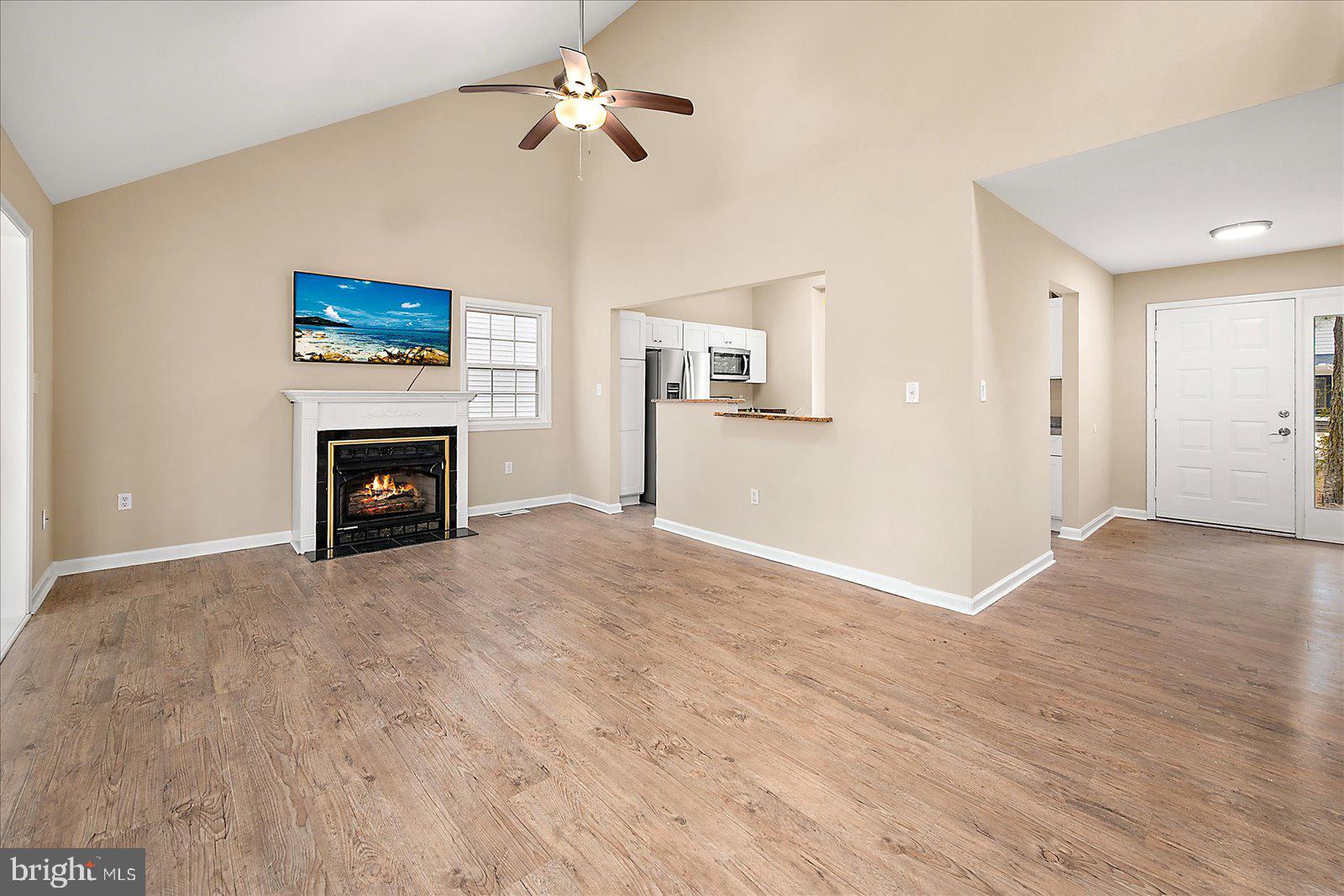 37 Watertown Road Ocean Pines, MD 21811 - Photo 10 of 86 a view of empty room with a fireplace and fan