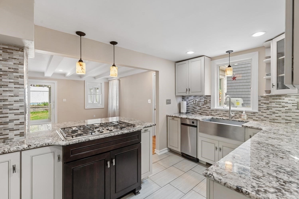 14 Church Street Westwood, MA 02090 - Photo 11 of 35 a kitchen with stainless steel appliances granite countertop a sink stove and refrigerator