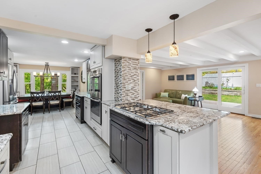 14 Church Street Westwood, MA 02090 - Photo 13 of 35 a open kitchen with stainless steel appliances granite countertop a stove and refrigerator