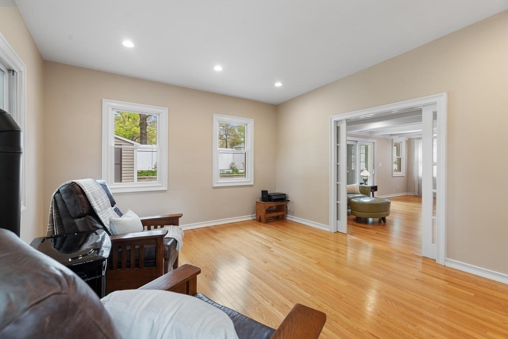14 Church Street Westwood, MA 02090 - Photo 18 of 35 a view of a livingroom with a chair and wooden floor