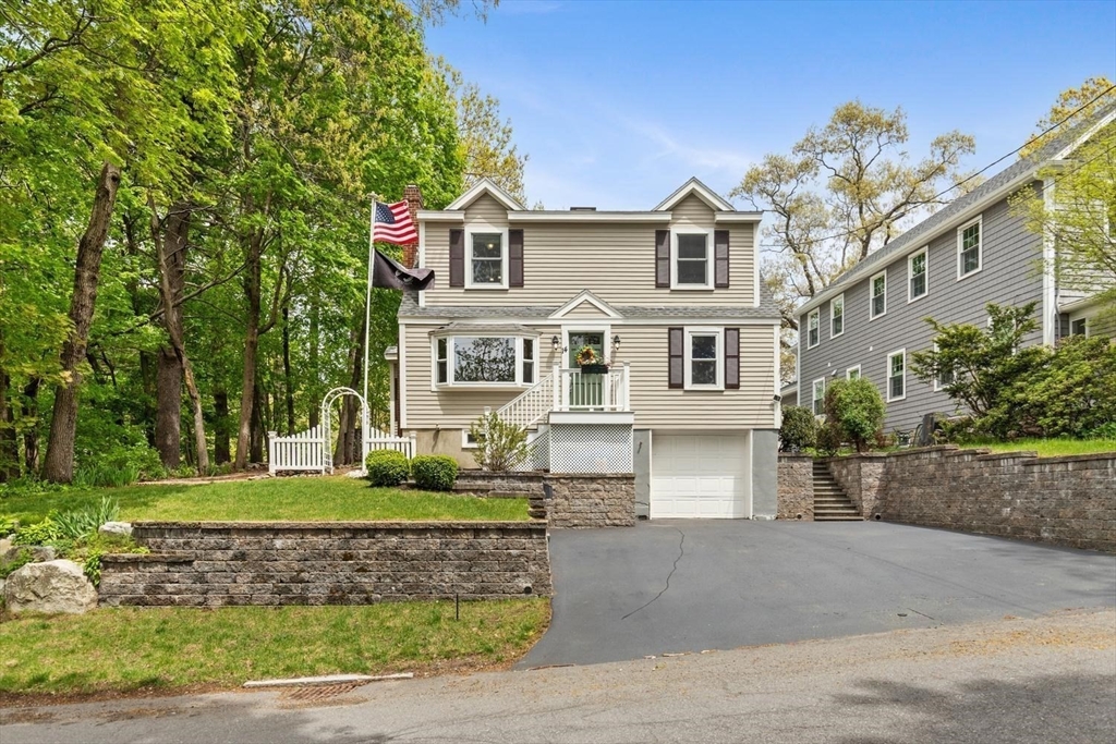 14 Church Street Westwood, MA 02090 - Photo 2 of 35 a front view of a house with a yard