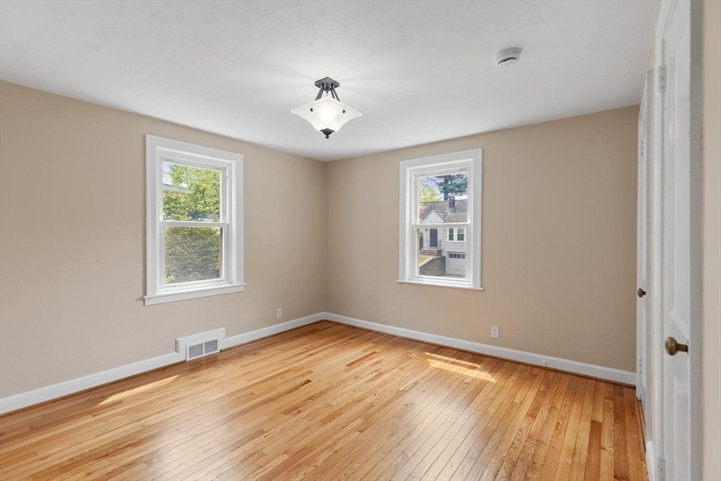14 Church Street Westwood, MA 02090 - Photo 21 of 35 a view of an empty room with wooden floor and a window