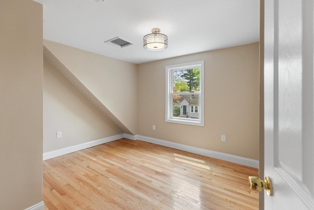 14 Church Street Westwood, MA 02090 - Photo 25 of 35 a view of an empty room with a window