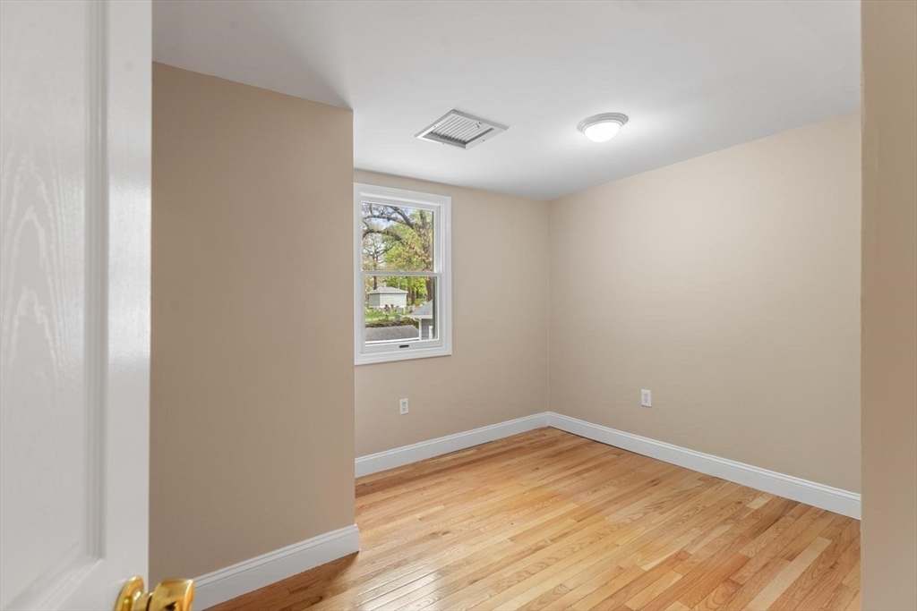14 Church Street Westwood, MA 02090 - Photo 26 of 35 a view of empty room with wooden floor and fan