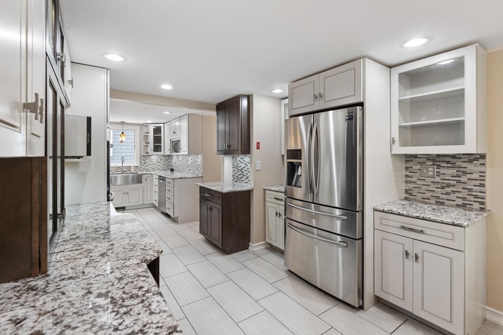 14 Church Street Westwood, MA 02090 - Photo 9 of 35 a kitchen with stainless steel appliances a refrigerator sink and microwave