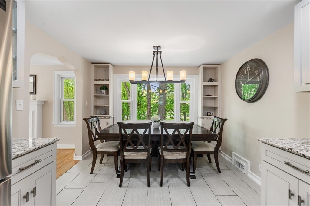 14 Church Street Westwood, MA 02090 - Photo 10 of 35 a view of a dining room with furniture window and wooden floor