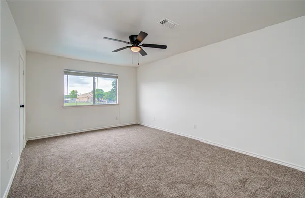 a bathroom with a shower and a sink