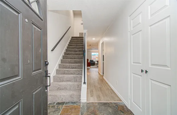 a backyard of a house with table and chairs