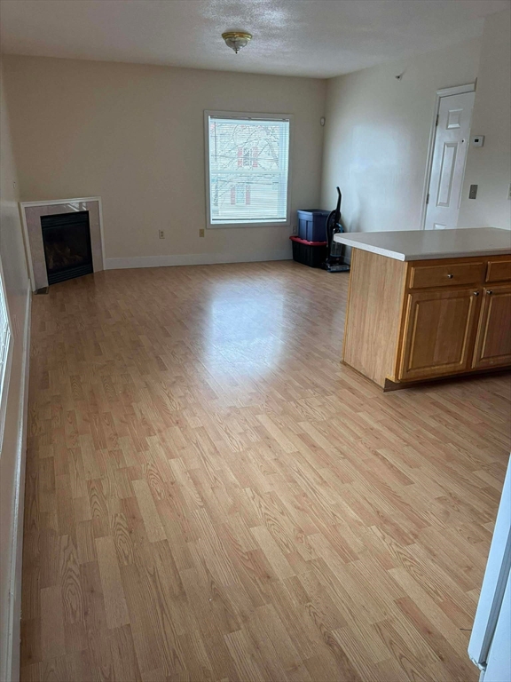 48 North Street, Unit 9 Gilbertville, MA 01031 - Photo 2 of 12 a view of a room with wooden floor and a window