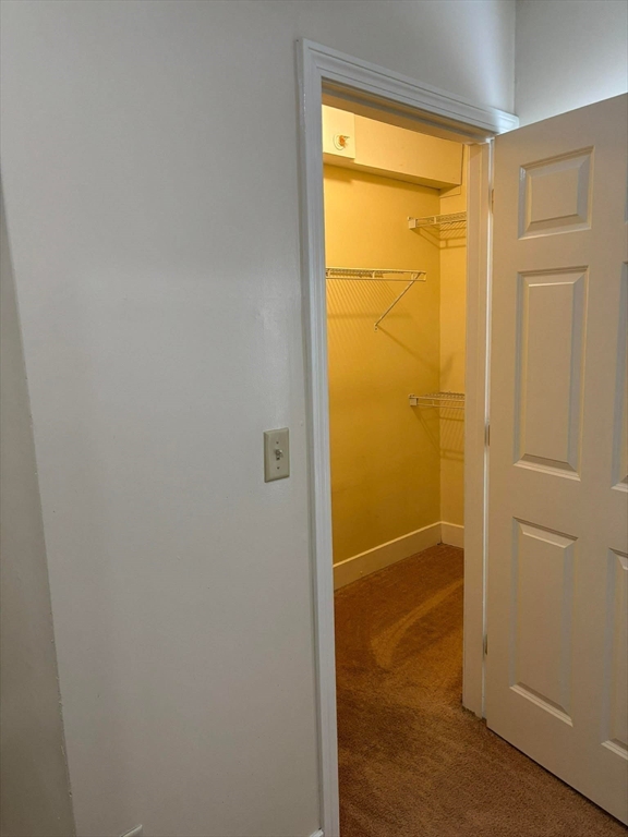 48 North Street, Unit 9 Gilbertville, MA 01031 - Photo 7 of 12 an empty room with a door
