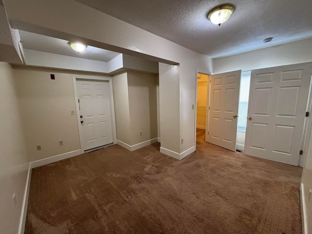 48 North Street, Unit 9 Gilbertville, MA 01031 - Photo 8 of 12 an empty room with closet area