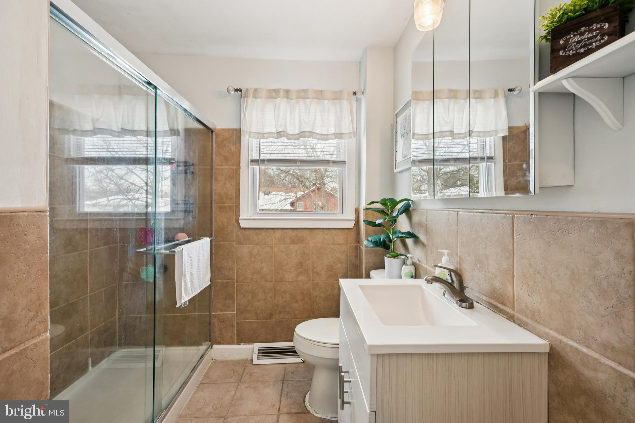 205 Avon Road Cherry Hill, NJ 08034 - Photo 12 of 25 a bathroom with a sink toilet and shower