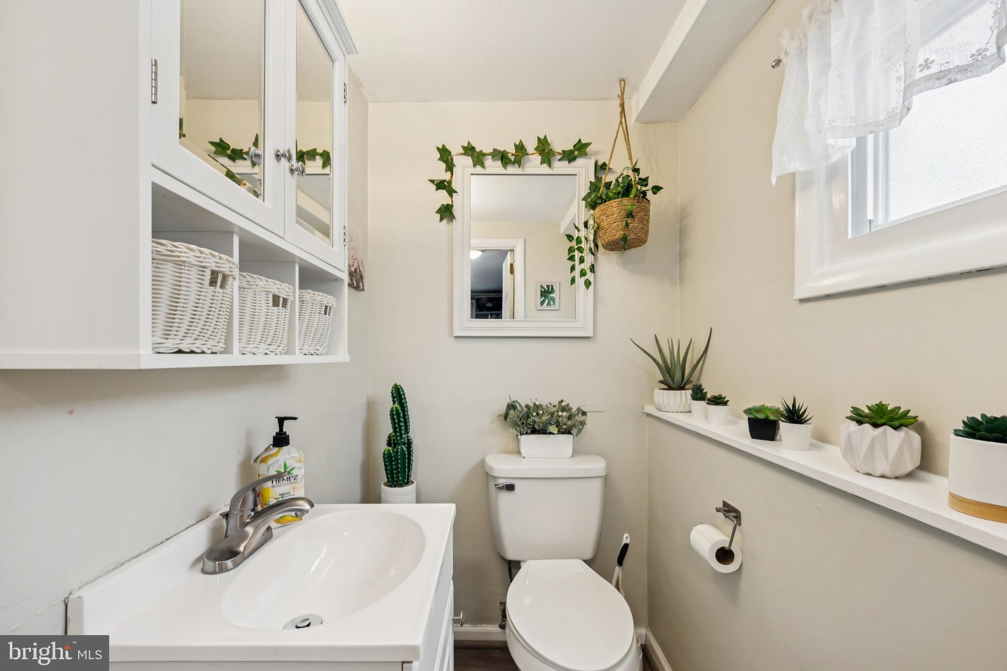 205 Avon Road Cherry Hill, NJ 08034 - Photo 18 of 25 a bathroom with a sink a toilet and mirror
