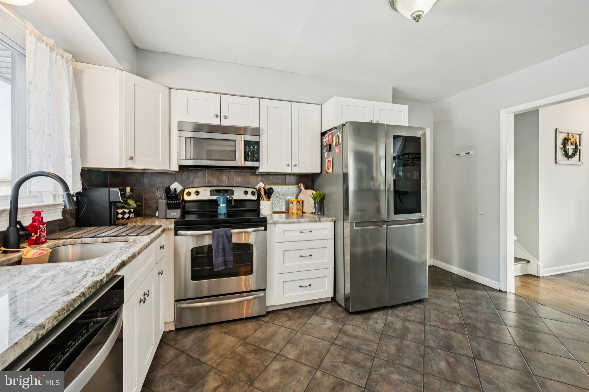 205 Avon Road Cherry Hill, NJ 08034 - Photo 24 of 25 a kitchen with stainless steel appliances granite countertop a refrigerator stove and sink