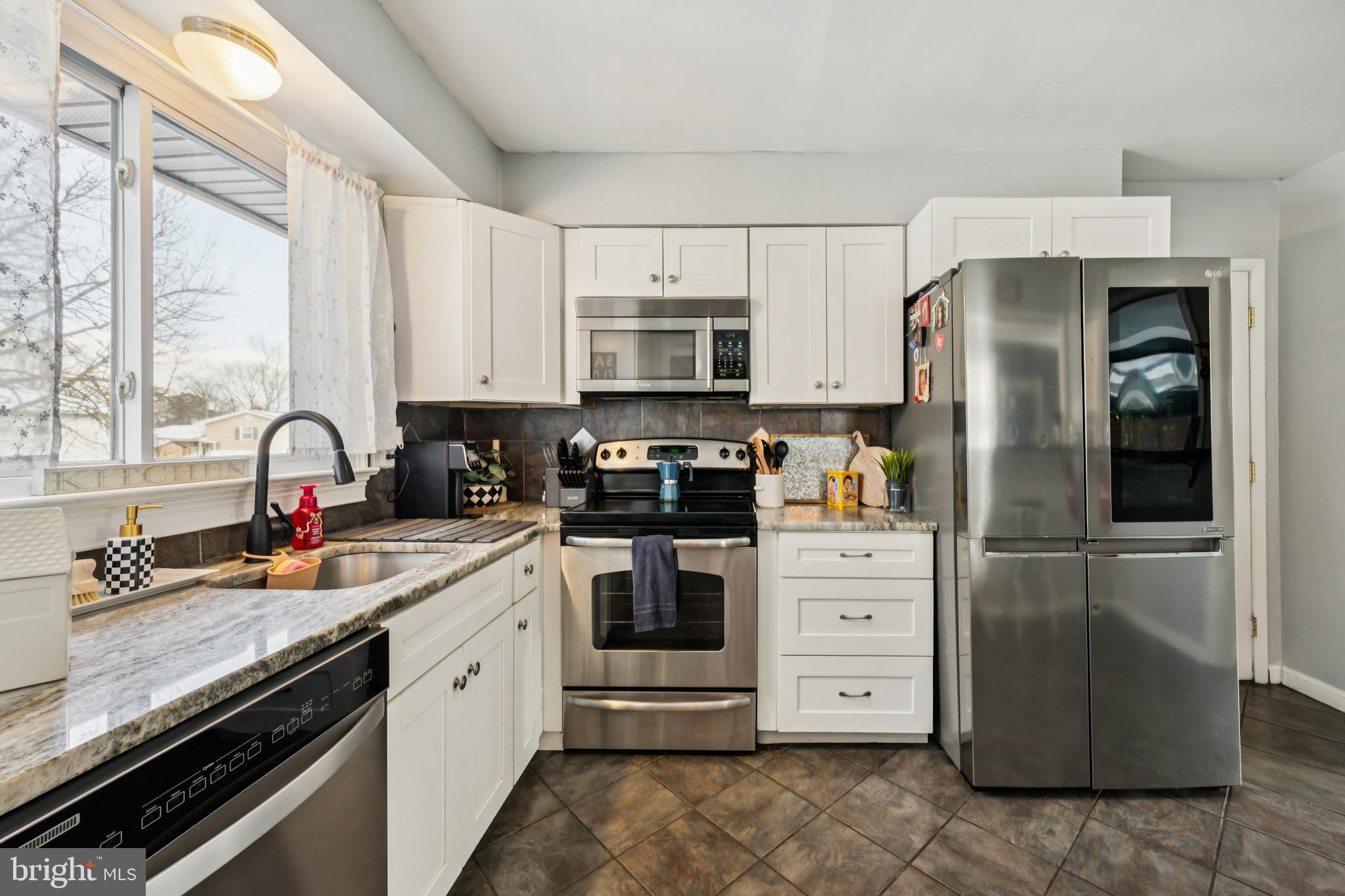 205 Avon Road Cherry Hill, NJ 08034 - Photo 25 of 25 a kitchen with stainless steel appliances granite countertop a refrigerator sink and stove