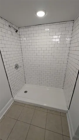 a bathroom with a shower and a bathtub