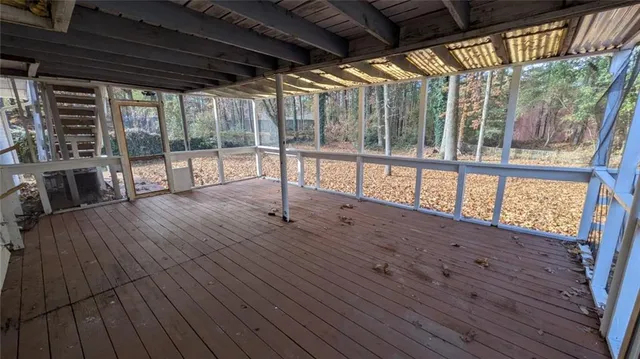 a view of porch with wooden floor