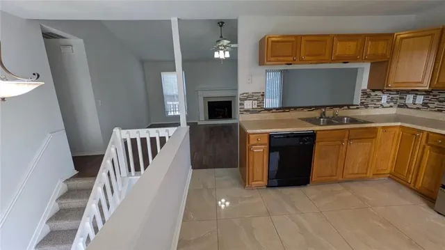 a kitchen with a cabinets and a stove top oven