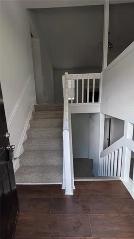 a view of entryway with wooden floor