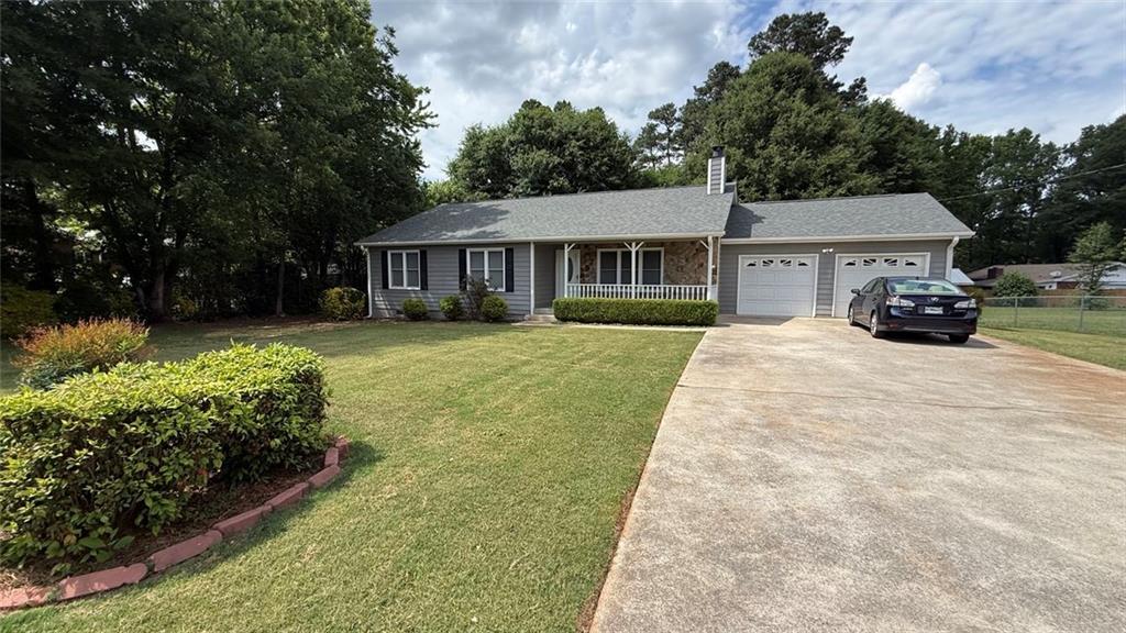 6683 Homestead Road Rex, GA 30273 - Photo 1 of 1 front view of a house with a yard