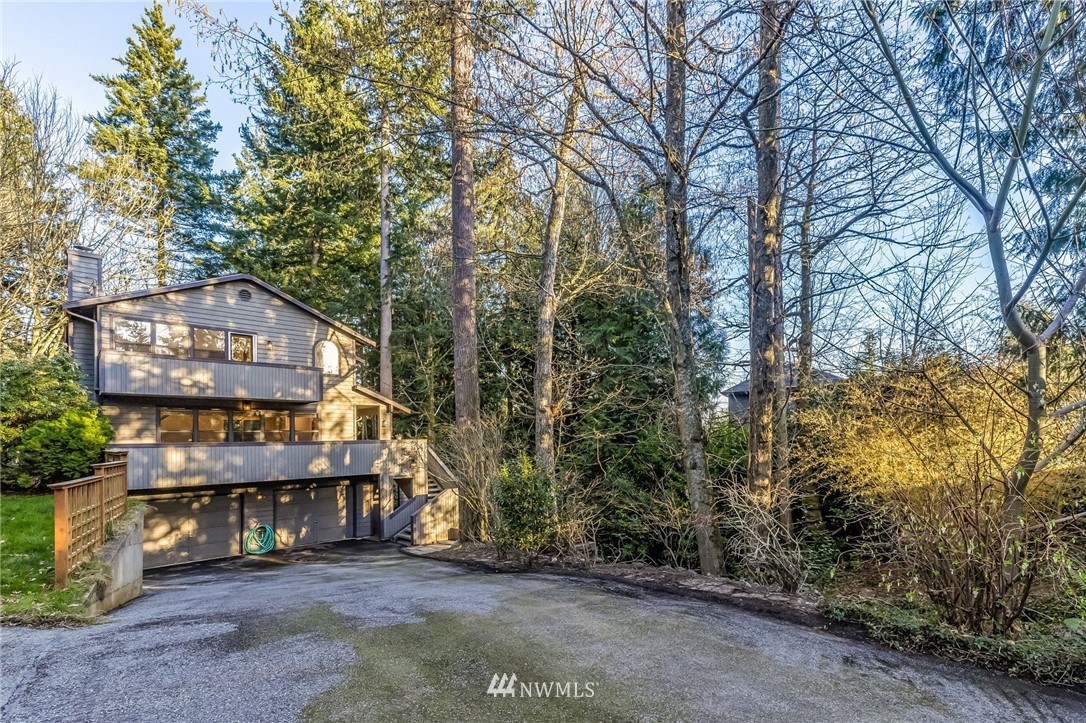 23511 Meridian Avenue South Bothell, WA 98021 - Photo 2 of 40 a view of a house with a trees front of house