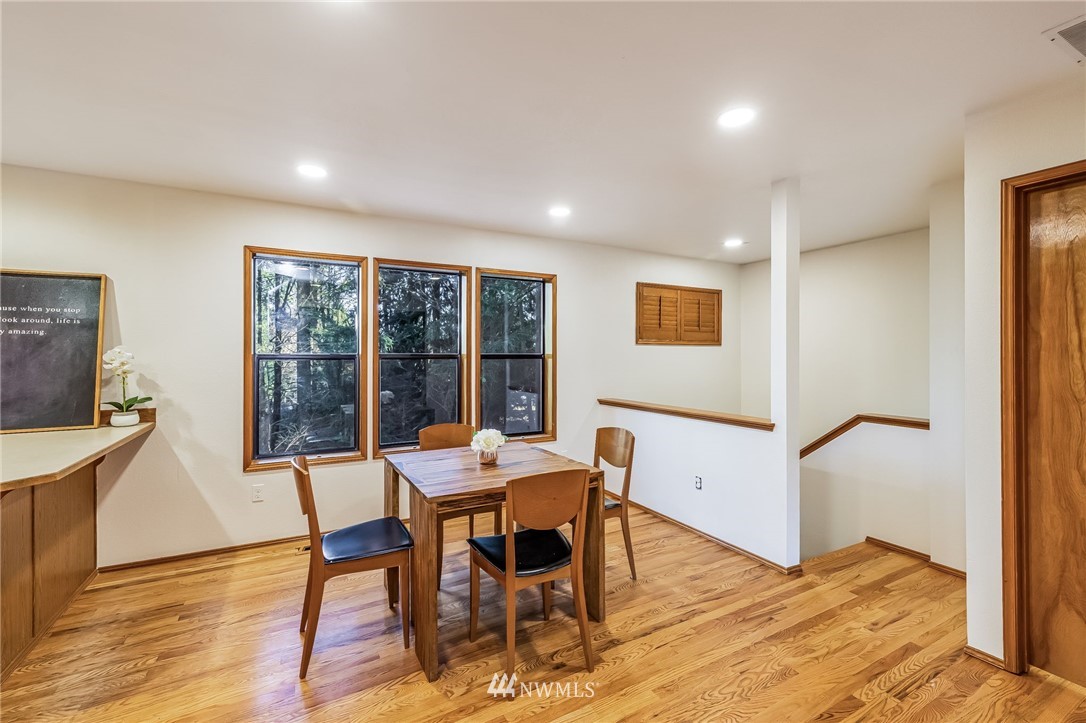 23511 Meridian Avenue South Bothell, WA 98021 - Photo 12 of 40 a view of a dining room with furniture window and wooden floor