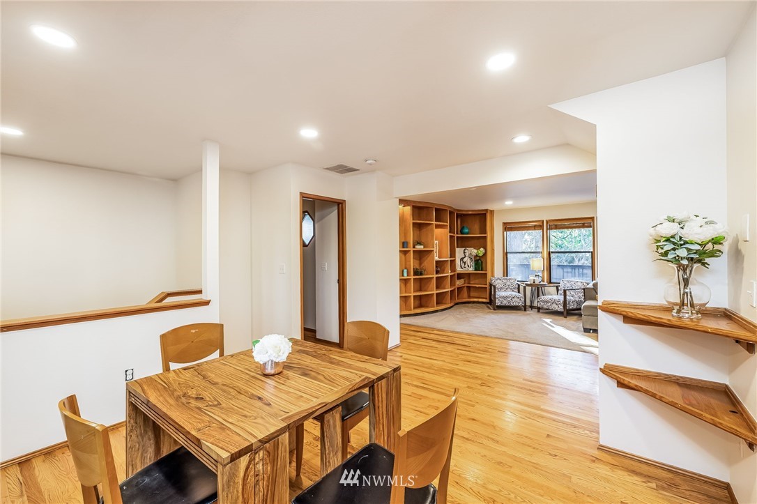 23511 Meridian Avenue South Bothell, WA 98021 - Photo 14 of 40 a living room with furniture a dining table and large windows