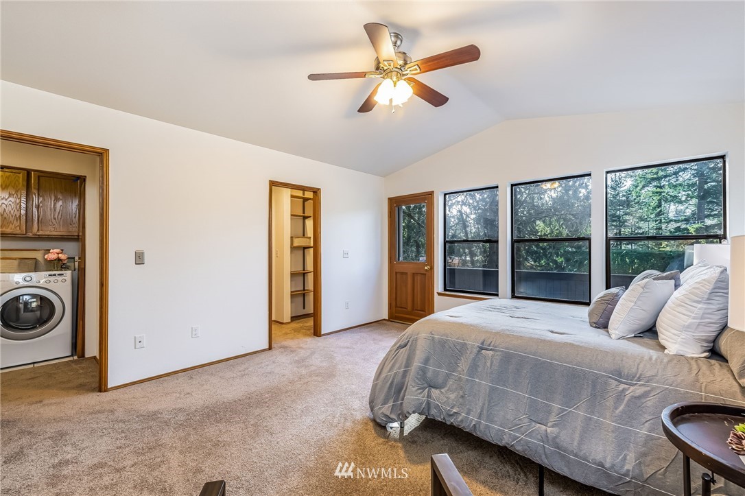 23511 Meridian Avenue South Bothell, WA 98021 - Photo 24 of 40 a bedroom with a bed and a large window