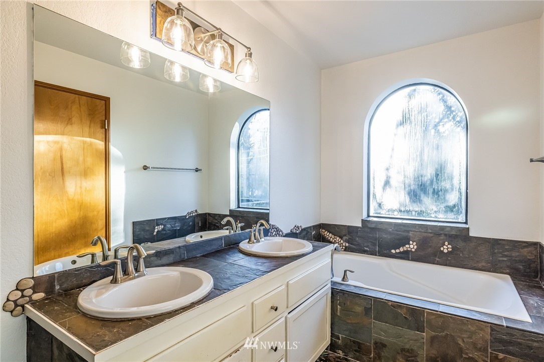 23511 Meridian Avenue South Bothell, WA 98021 - Photo 28 of 40 a bathroom with a sink and a mirror