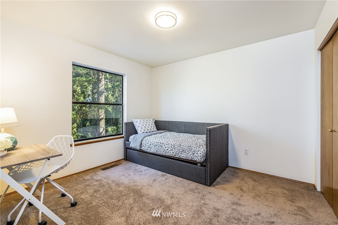 23511 Meridian Avenue South Bothell, WA 98021 - Photo 32 of 40 a living room with furniture and a window
