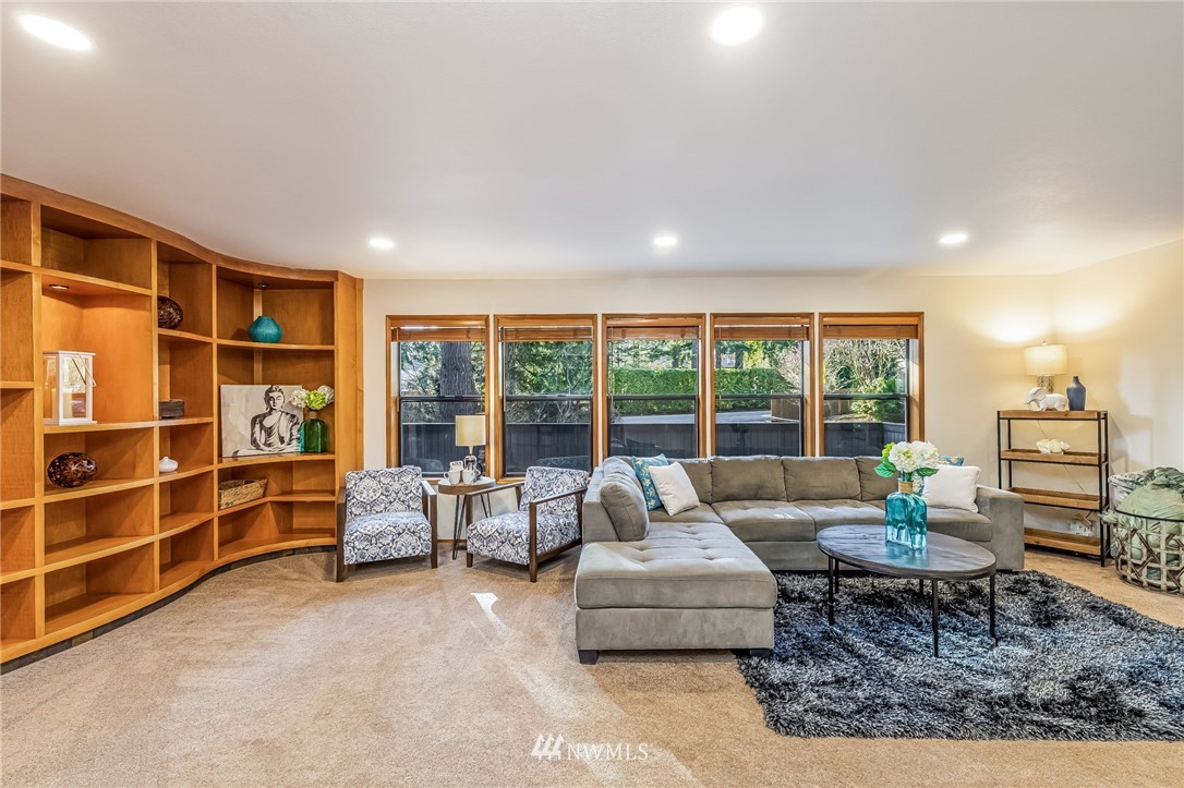 23511 Meridian Avenue South Bothell, WA 98021 - Photo 6 of 40 a living room with furniture and a large window