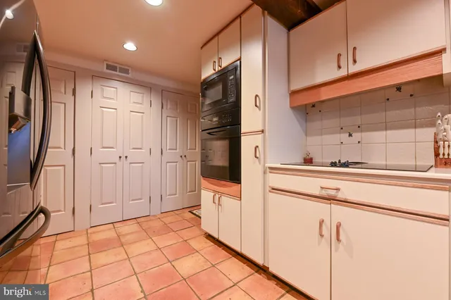 a bed room with a bed and a chair