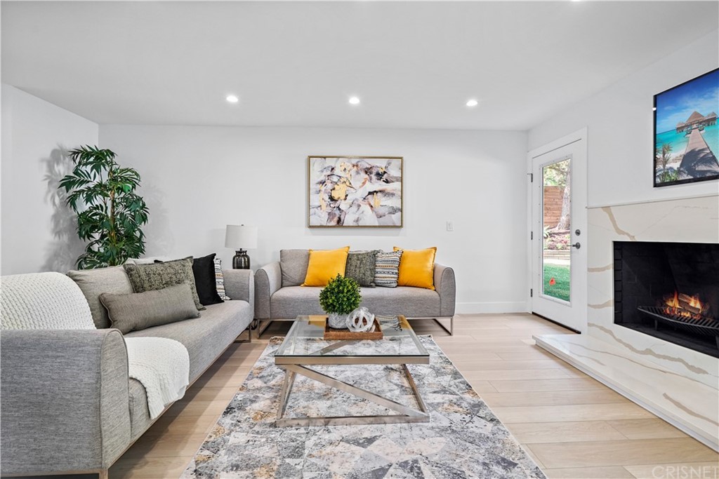 3675 Denair Street Pasadena, CA 91107 - Photo 12 of 37 a living room with furniture and a fireplace