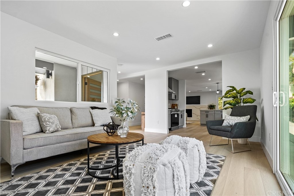 3675 Denair Street Pasadena, CA 91107 - Photo 14 of 37 a living room with furniture and a rug