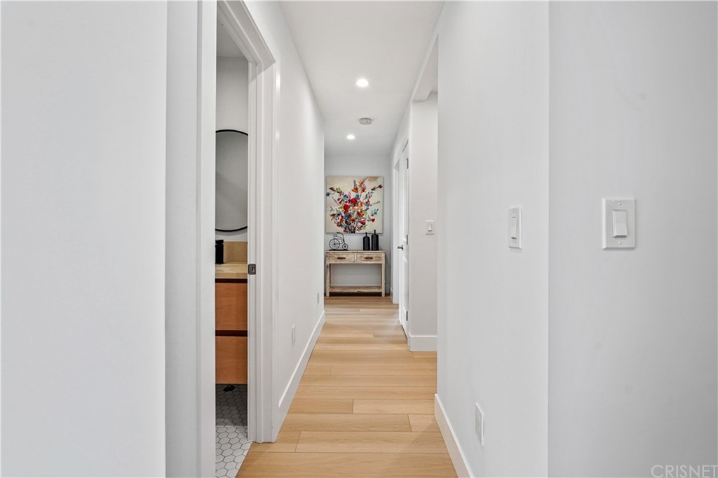 3675 Denair Street Pasadena, CA 91107 - Photo 16 of 37 a view of a hallway with white walls and stairs